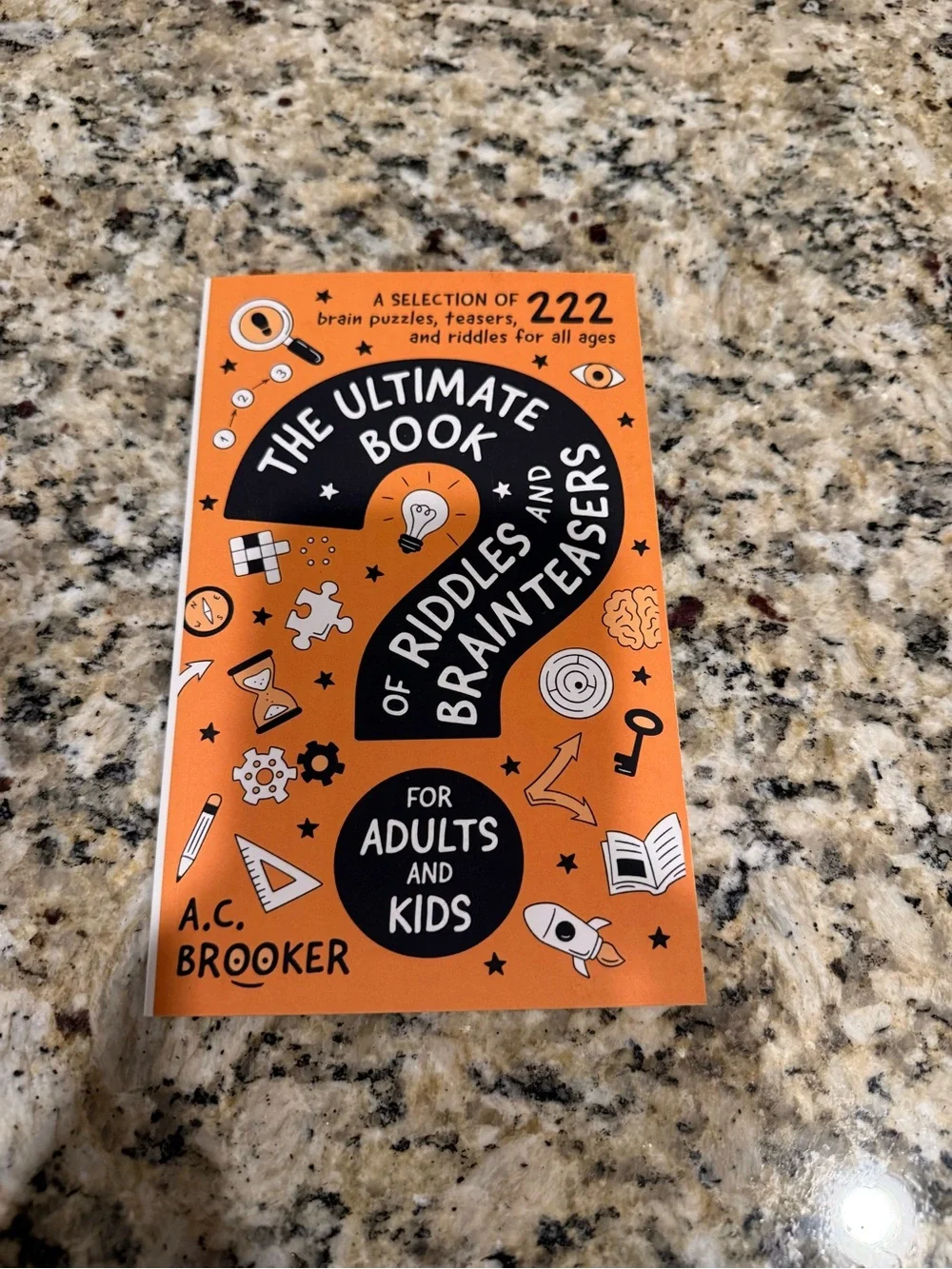 The Ultimate Book of Riddles and Brain Teasers - Orange Cover